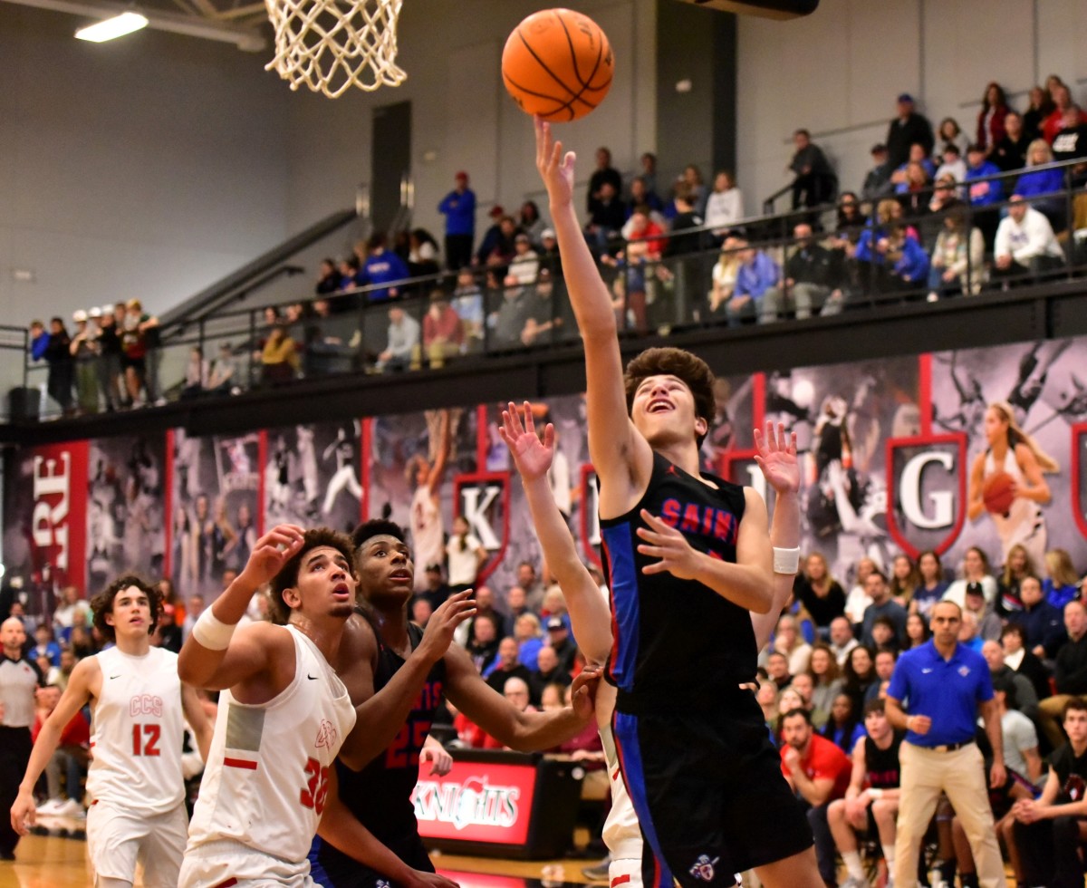 Oklahoma Christian School (in black) and Crossings Christian face off in a game Jan. 26, 2024. The Knights defeated the Saints, 67-56.